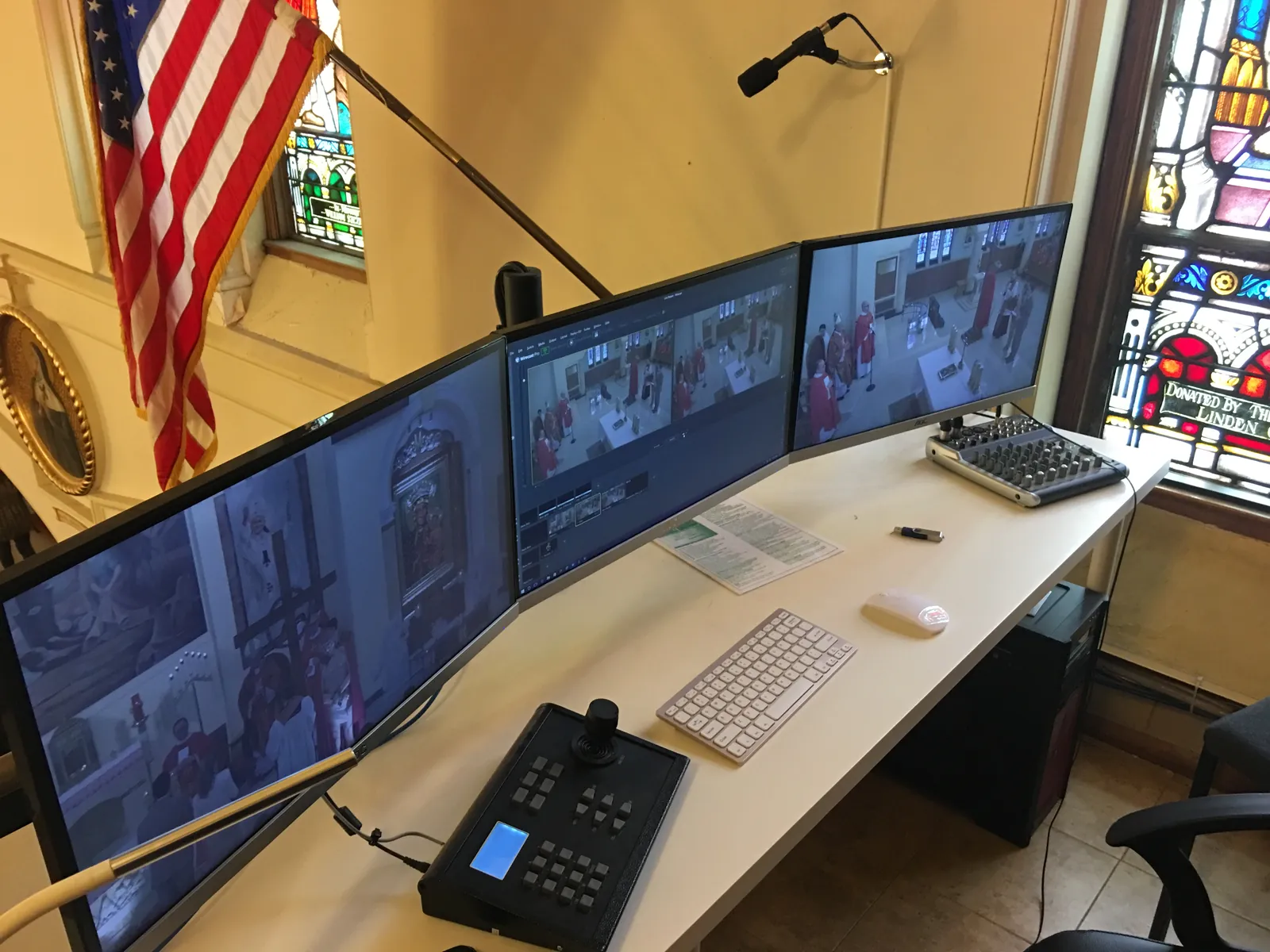 Live-streaming control room with monitors and camera controller